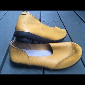 Yellow leather and suede flats